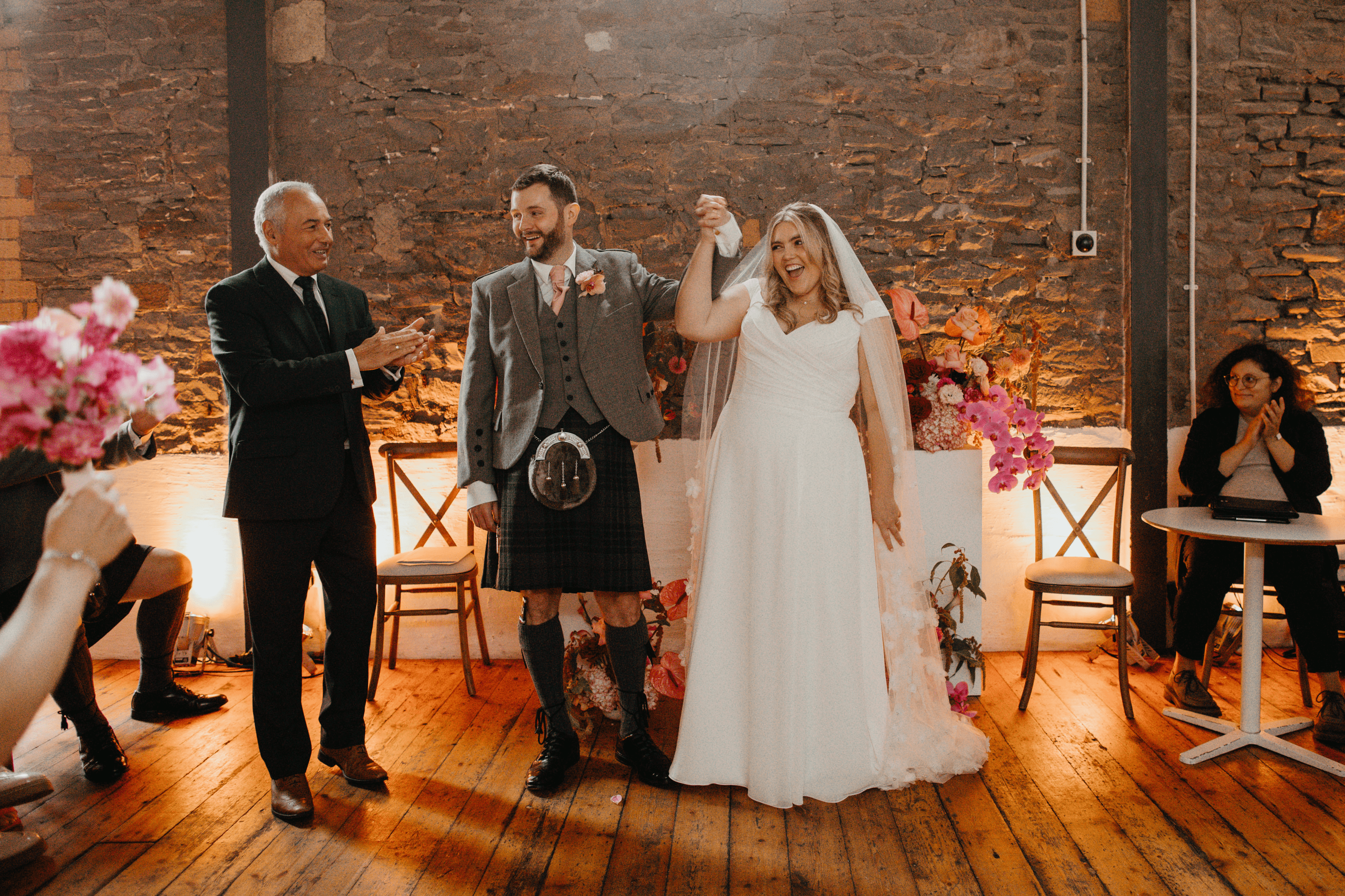 bride and groom hand-in-hand wedding ceremony at paintworks, Bristol